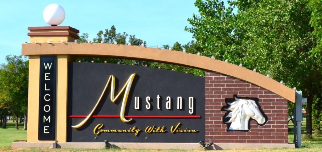 Welcome to Mustang Oklahoma city sign near the entrance to Mustang OK.